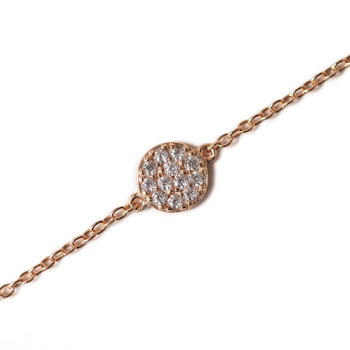 Rose gold vermeil pavé disc chain bracelet with white zirconia, close-up detail on a white background