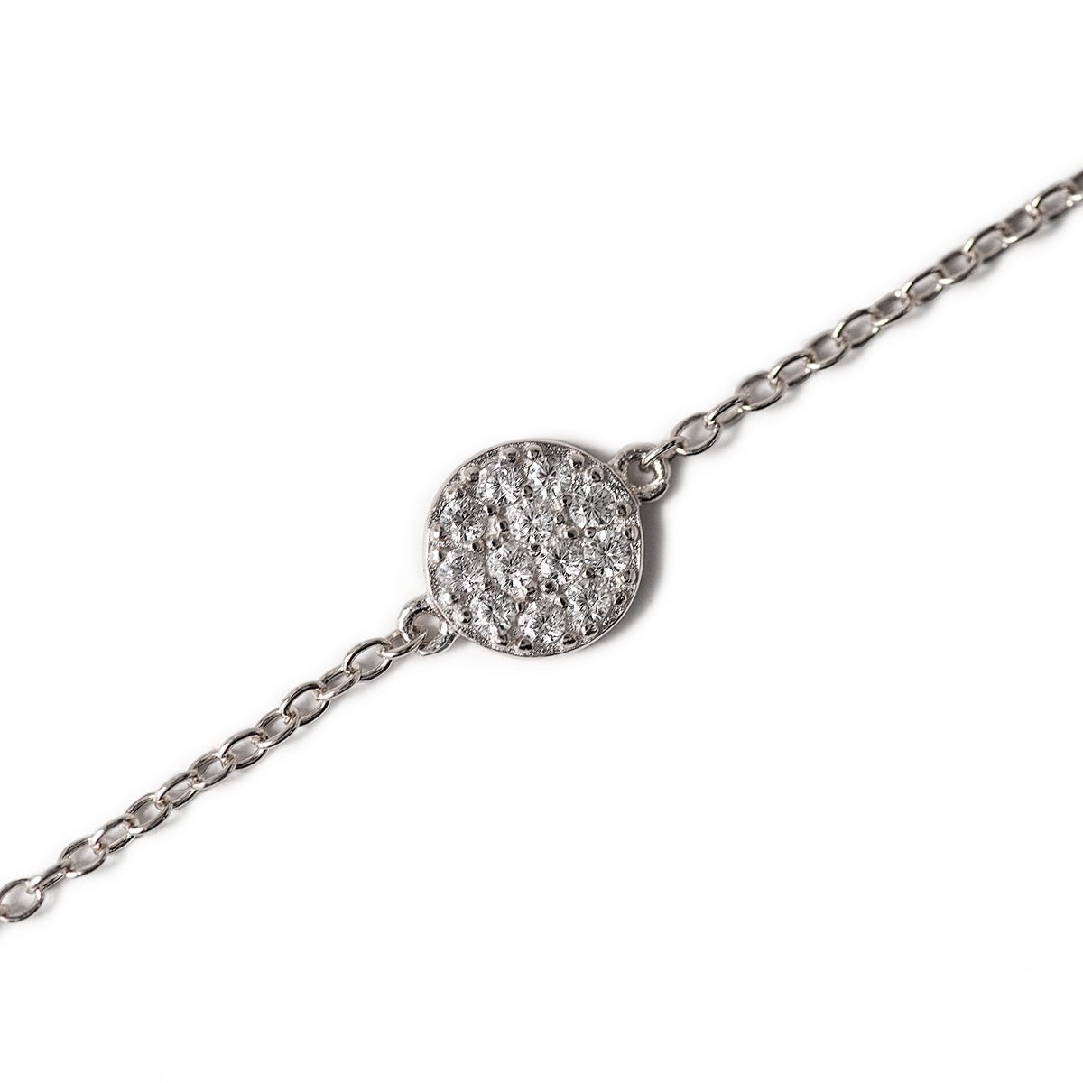 Sterling silver pavé disc chain bracelet with white zirconia, close-up detail on a white background
