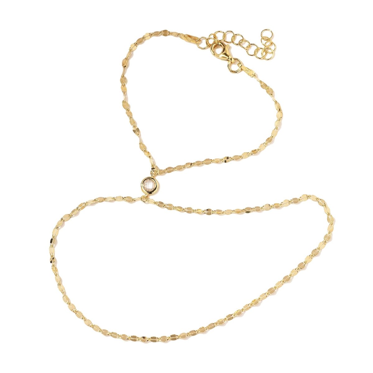 Gold vermeil hand chain with a flat link chain and round white zirconia, on a white background