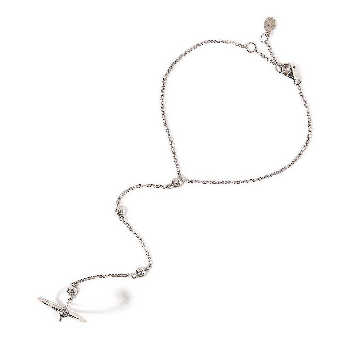 Sterling silver hand chain with bezel-set clear stones and a cross ring, on a white background