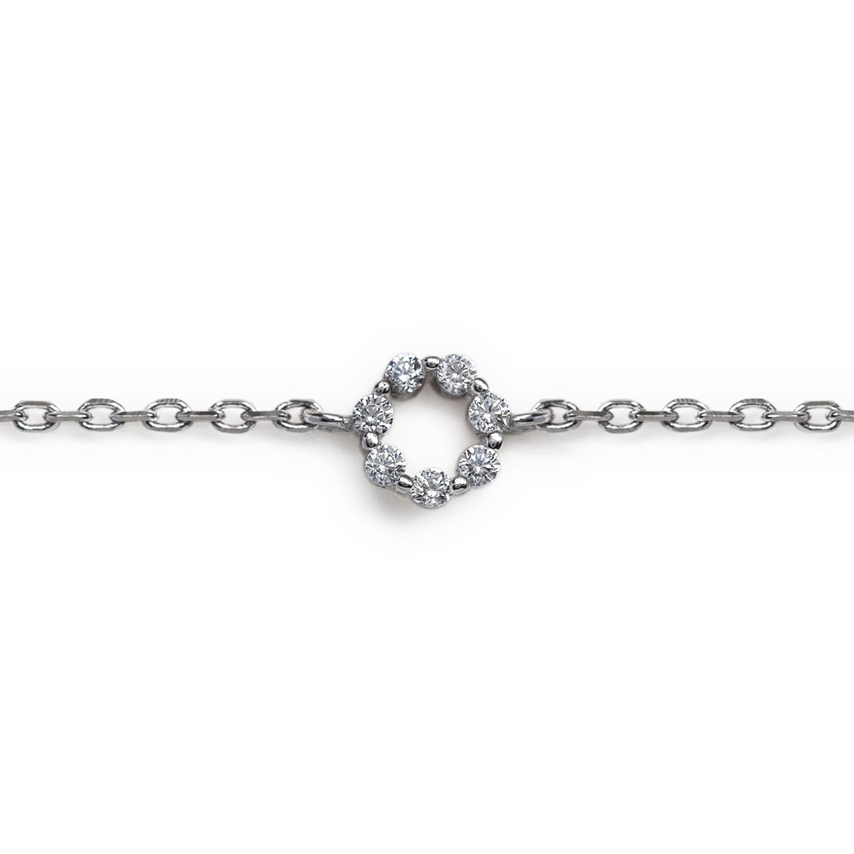 Sterling silver chain bracelet with a zirconia open circle station, close-up detail on a white background
