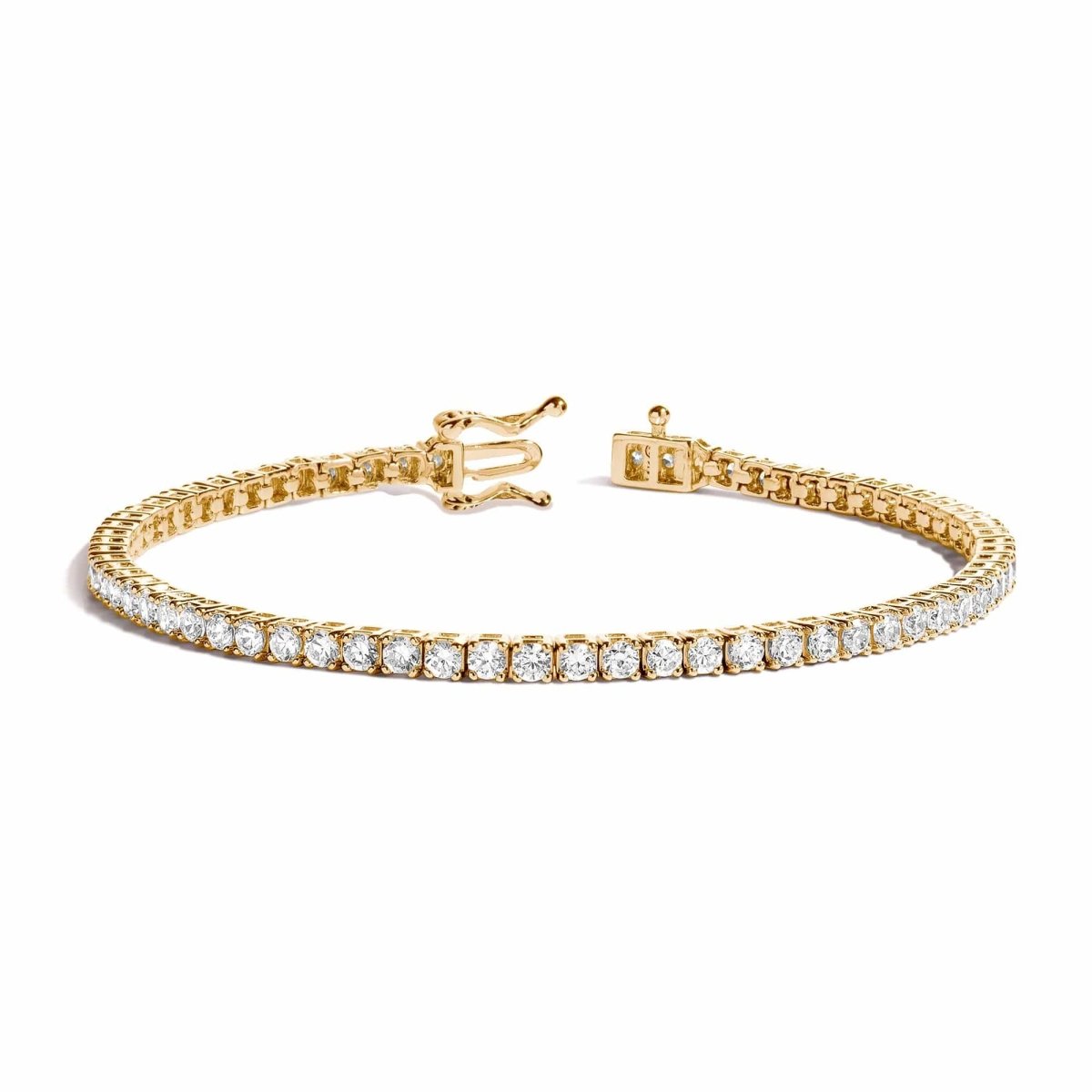 14K gold diamond tennis bracelet with round stones and a box clasp, on a white background