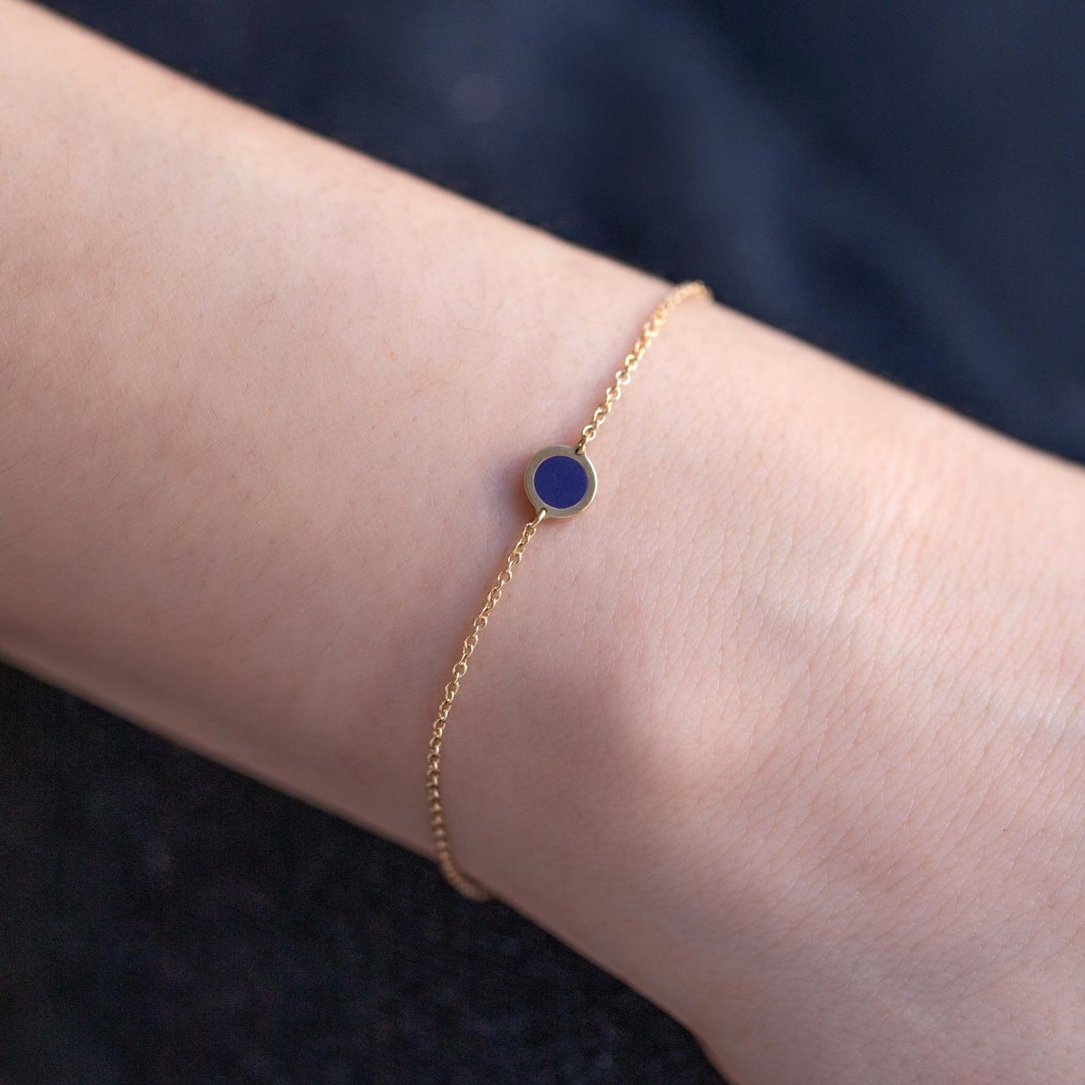 14K gold lapis lazuli disc chain bracelet shown on a model's wrist