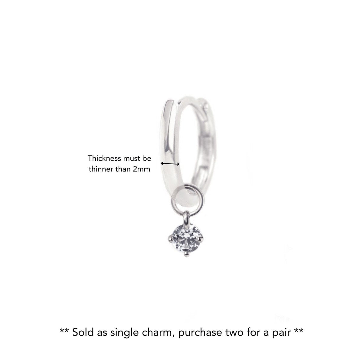 14K white gold huggie hoop with a clear moissanite charm, thickness guide noting hoops under 2mm