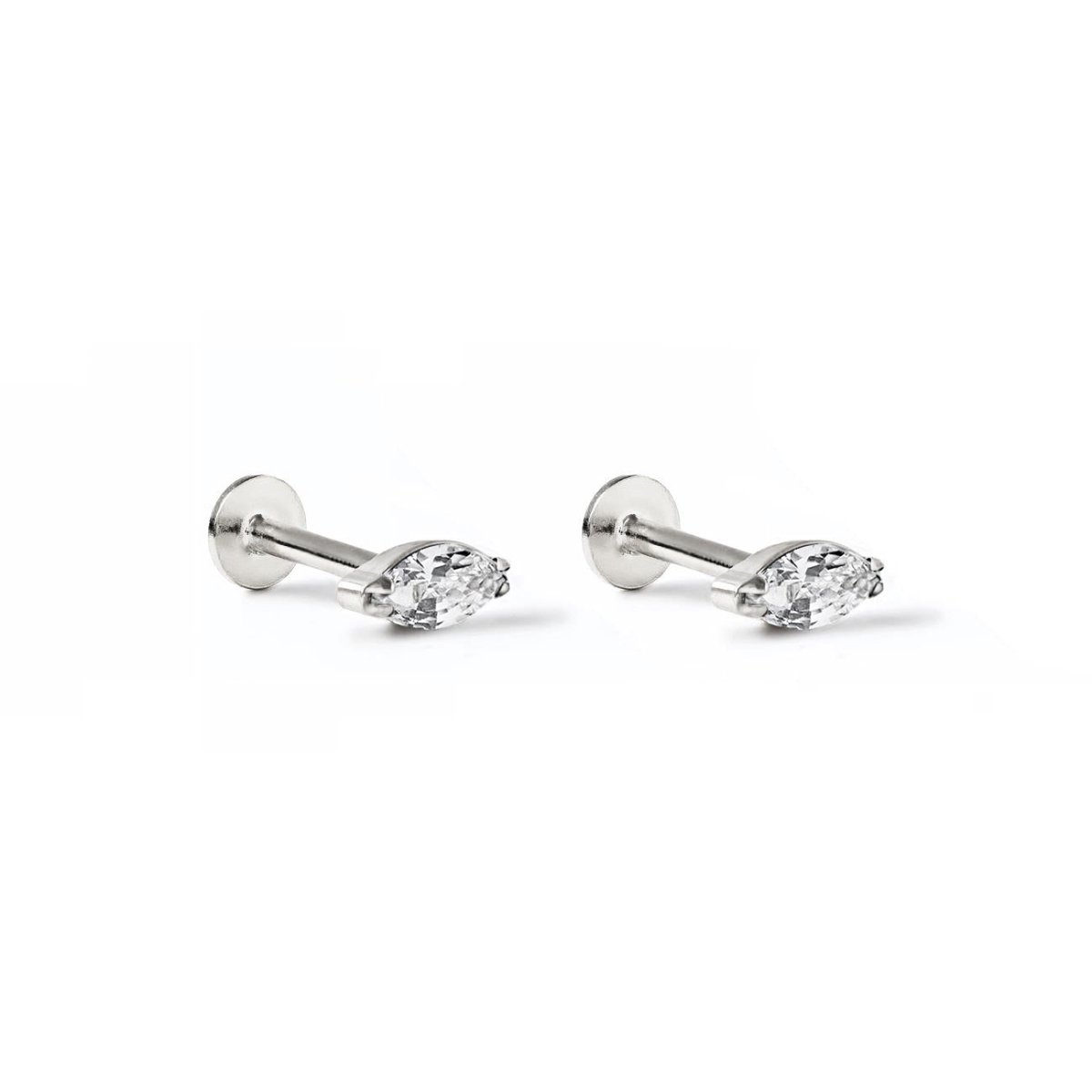 Pair of titanium marquise white zirconia flat back studs with a silvery finish, on a white background