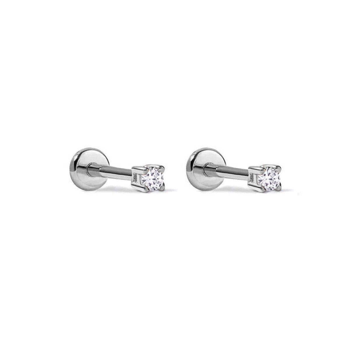 Pair of titanium flat back studs with clear zirconia stones, on a white background