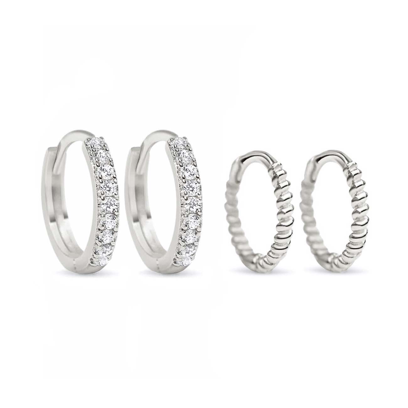 Sterling silver huggie set, a zirconia pavé pair and a twisted rope pair, on a white background