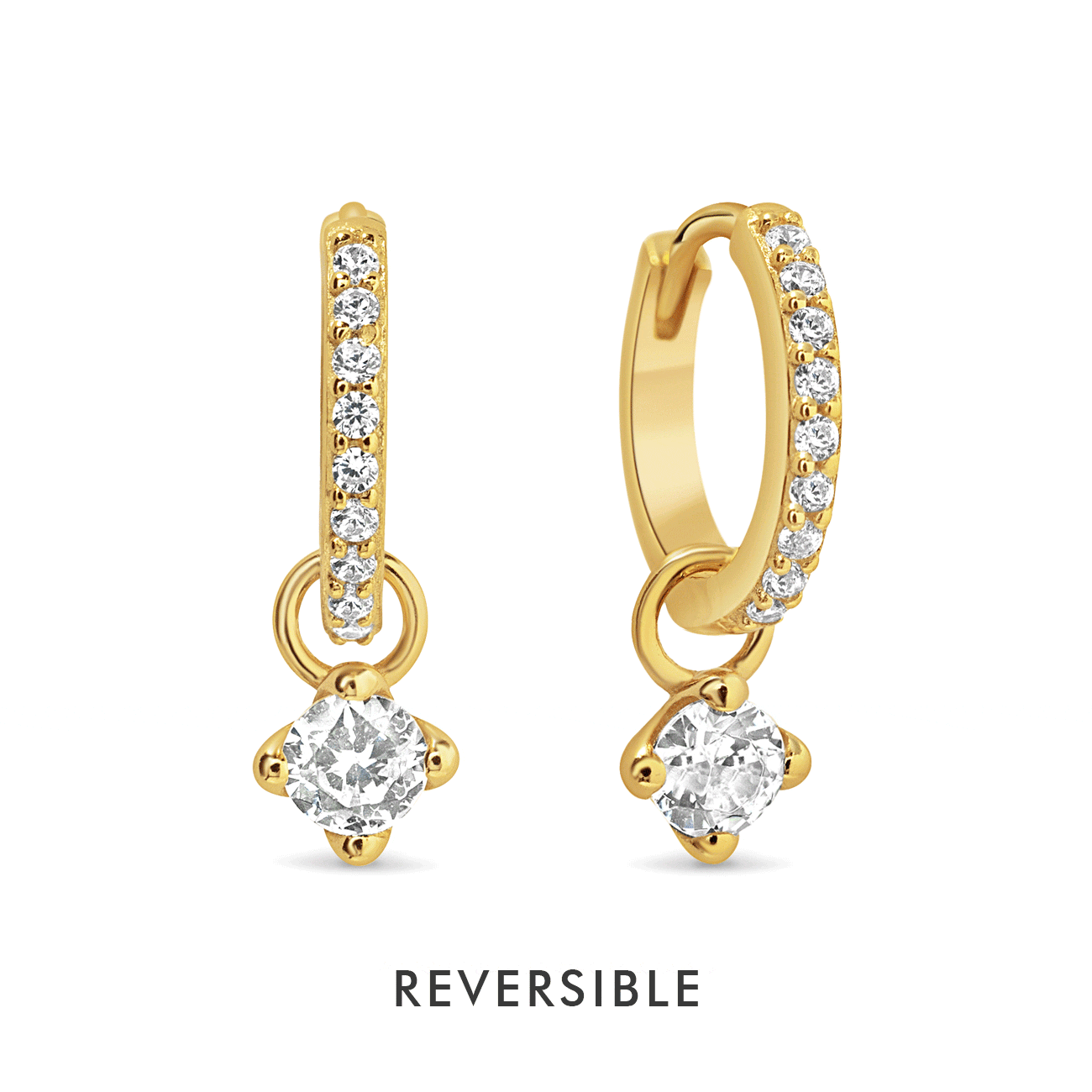 Gold vermeil pavé huggie hoops with dangling white zirconia charms, on a white background