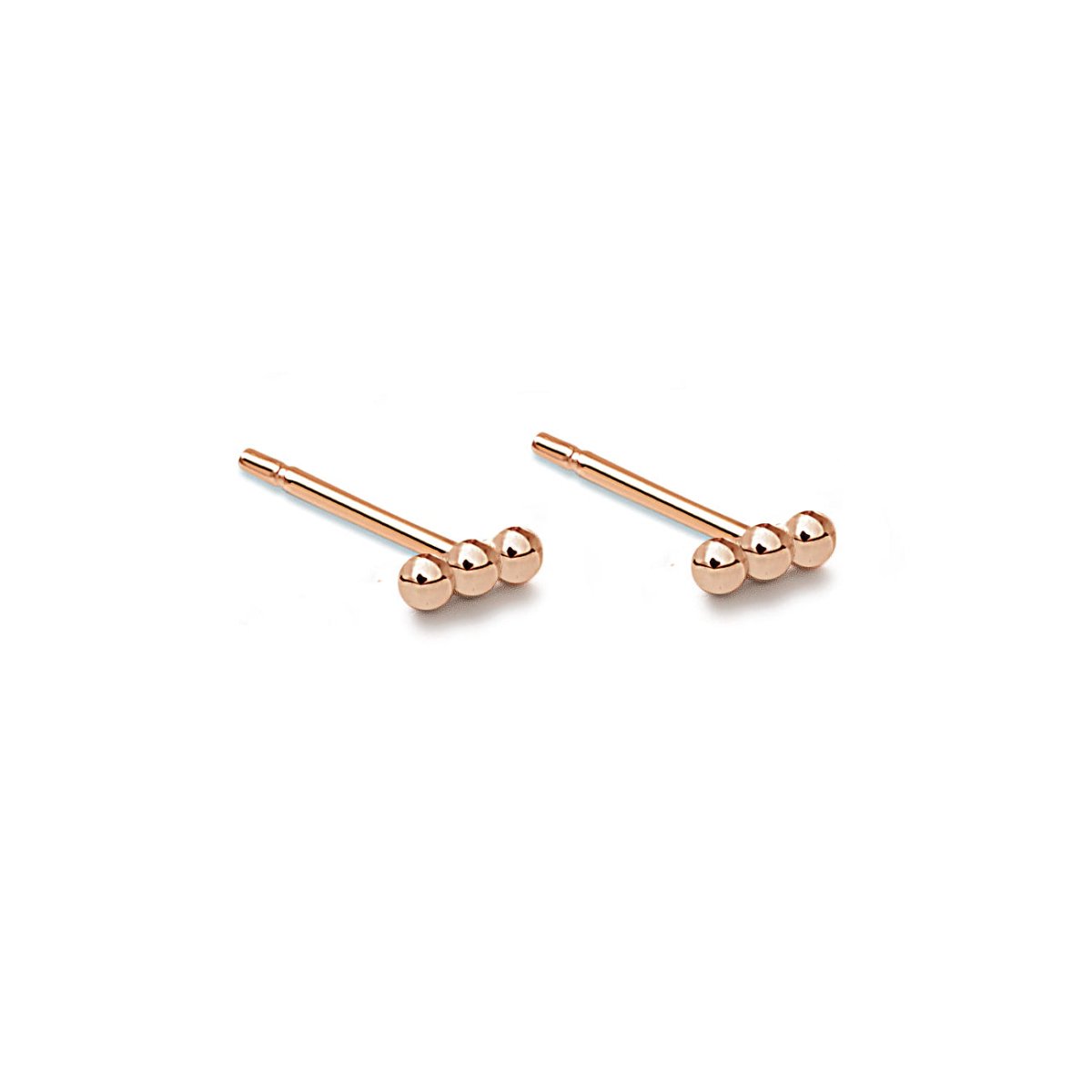 Pair of rose gold vermeil tiny bead bar studs with three-bead clusters, on a white background