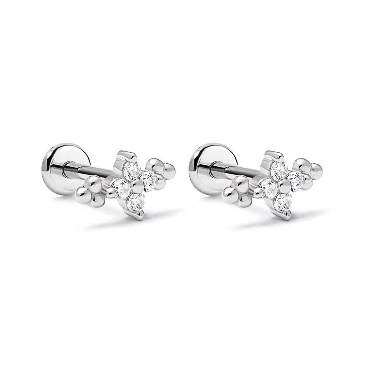 Pair of sterling silver flat back studs with four-stone clear zirconia flower clusters, on a white background