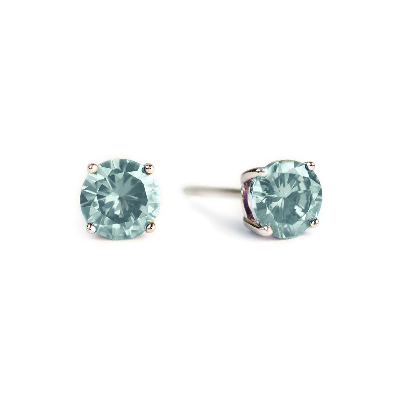 Pair of sterling silver aquamarine studs with round pale blue stones, on a white background