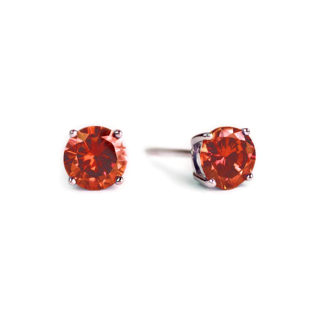 Pair of sterling silver garnet studs with round red-orange stones, on a white background