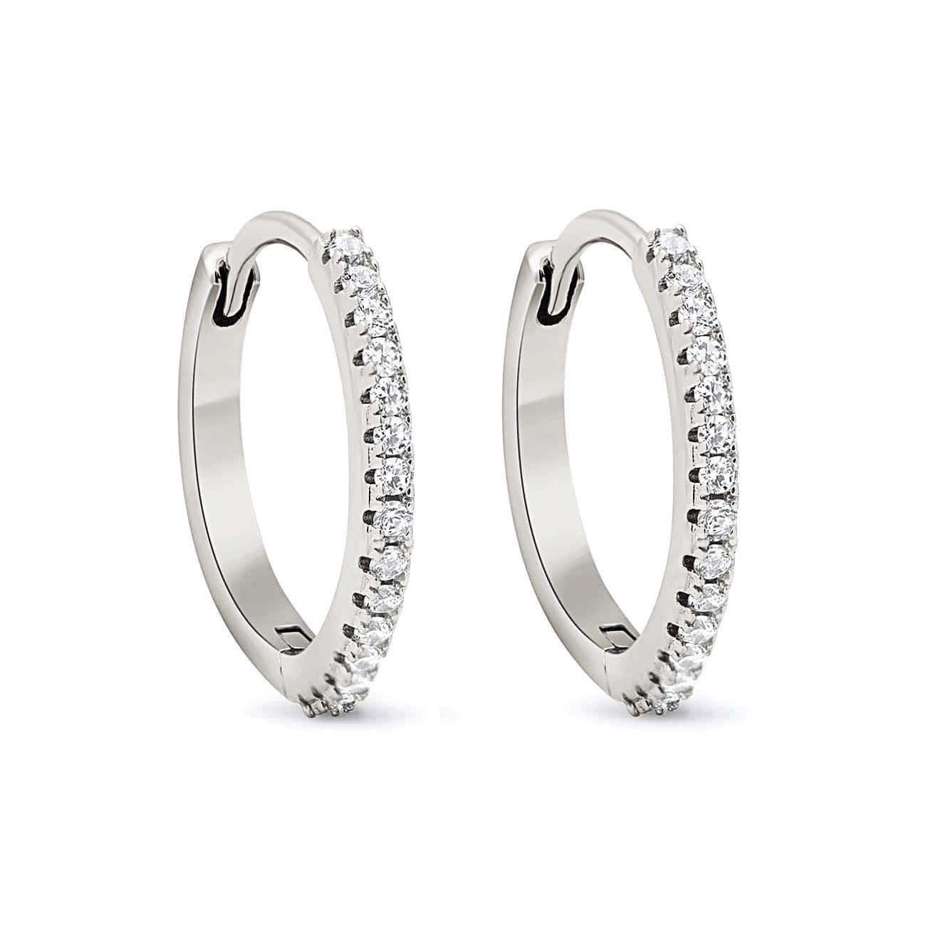 Sterling silver pavé small hoops set with white zirconia, pair shown on a white background