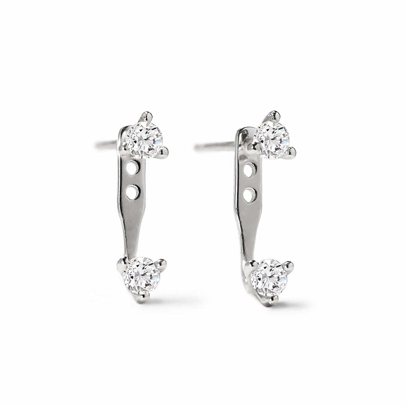 Sterling silver earring jacket studs with two round clear stones each, on a white background