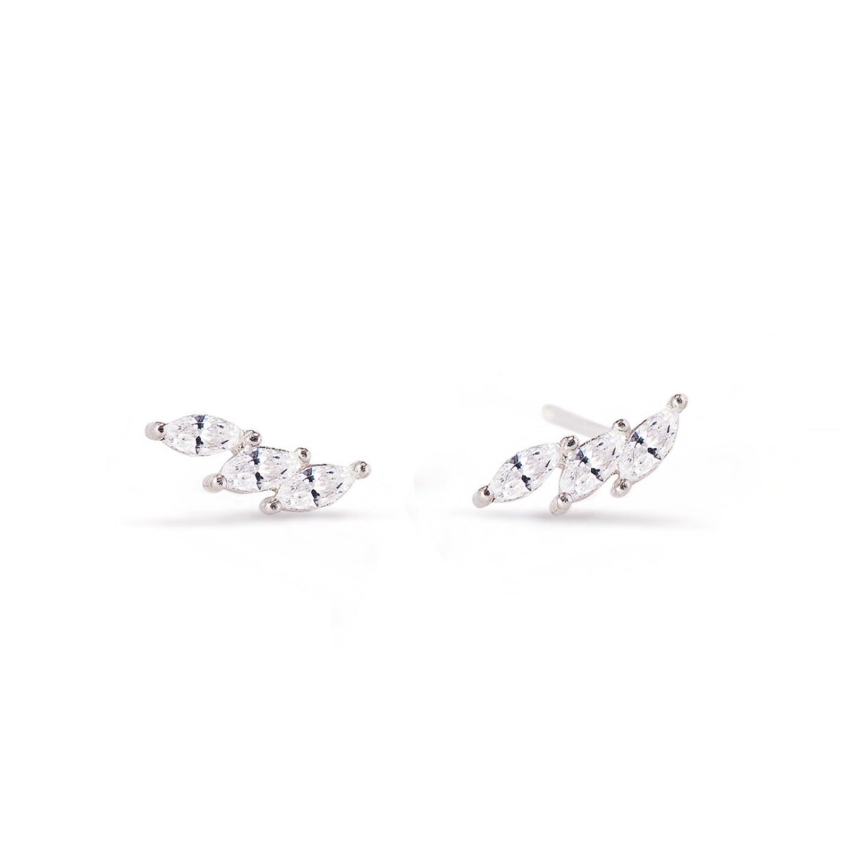 Pair of sterling silver curved studs with marquise white zirconia stones, on a white background