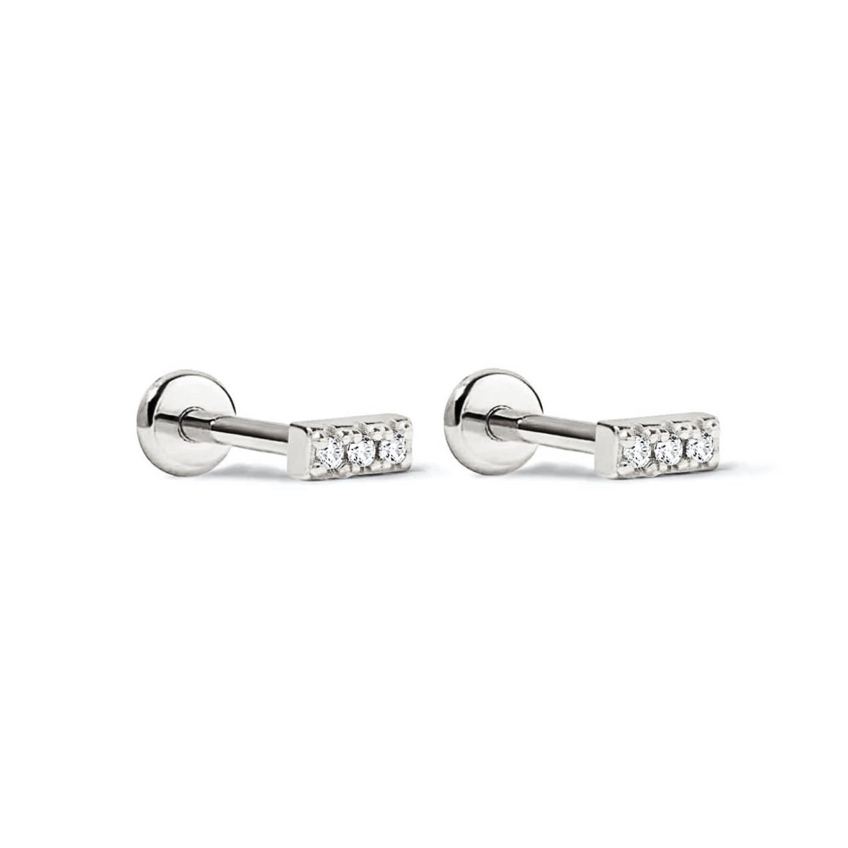 Sterling silver pavé bar flat back studs with three clear white zirconia stones, on a white background
