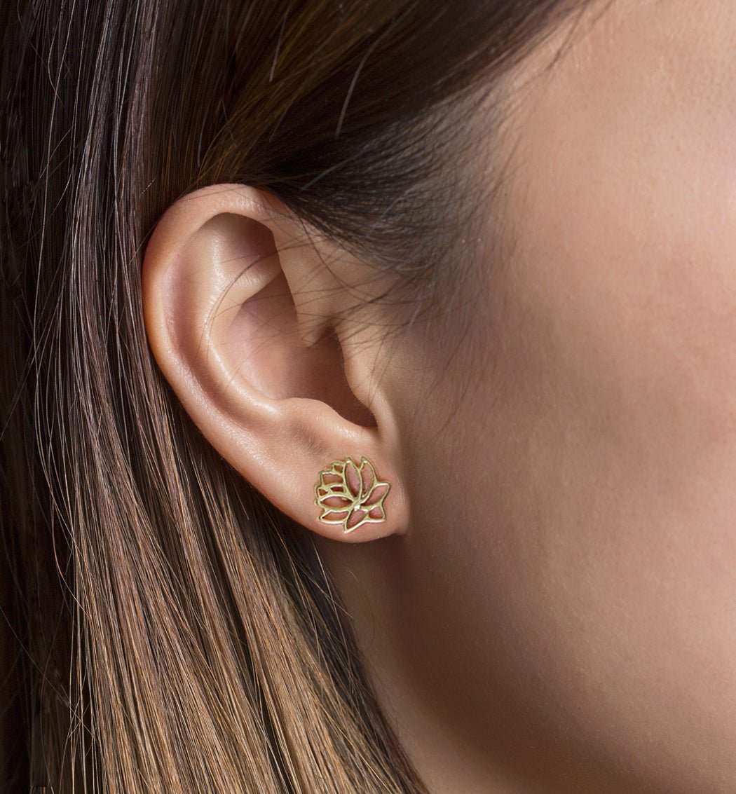 Gold vermeil lotus flower stud earring shown on a model's earlobe