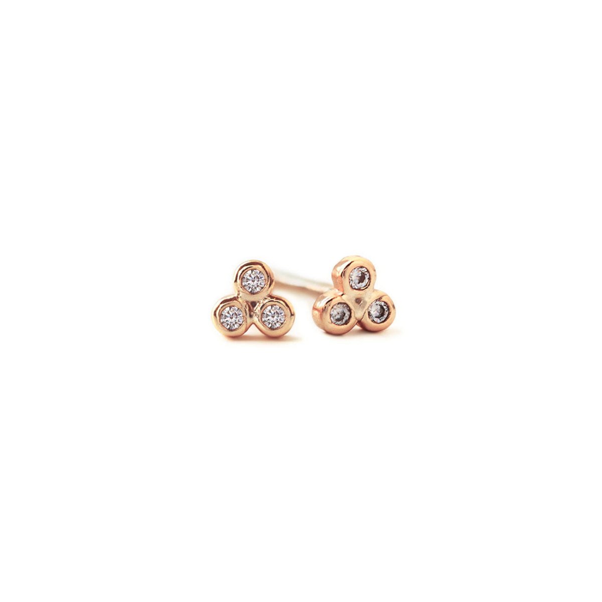 Rose gold vermeil three-stone zirconia cluster stud earrings, on a white background