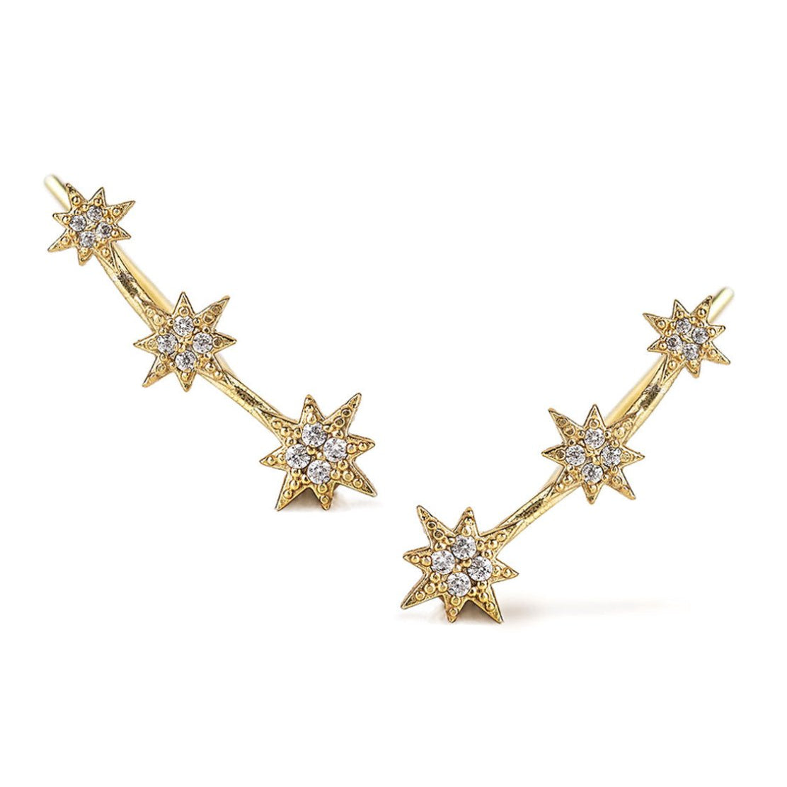 Pair of gold vermeil six-point star ear climbers pave-set with white zirconia, on a white background