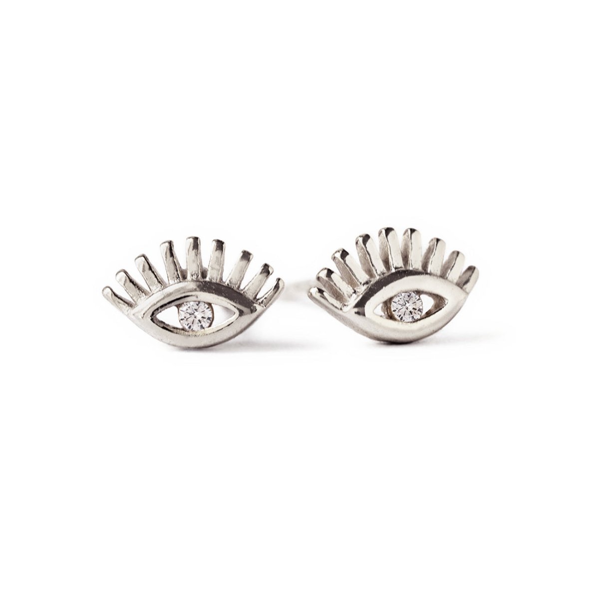 Sterling silver evil eye stud earrings with a clear center stone, on a white background