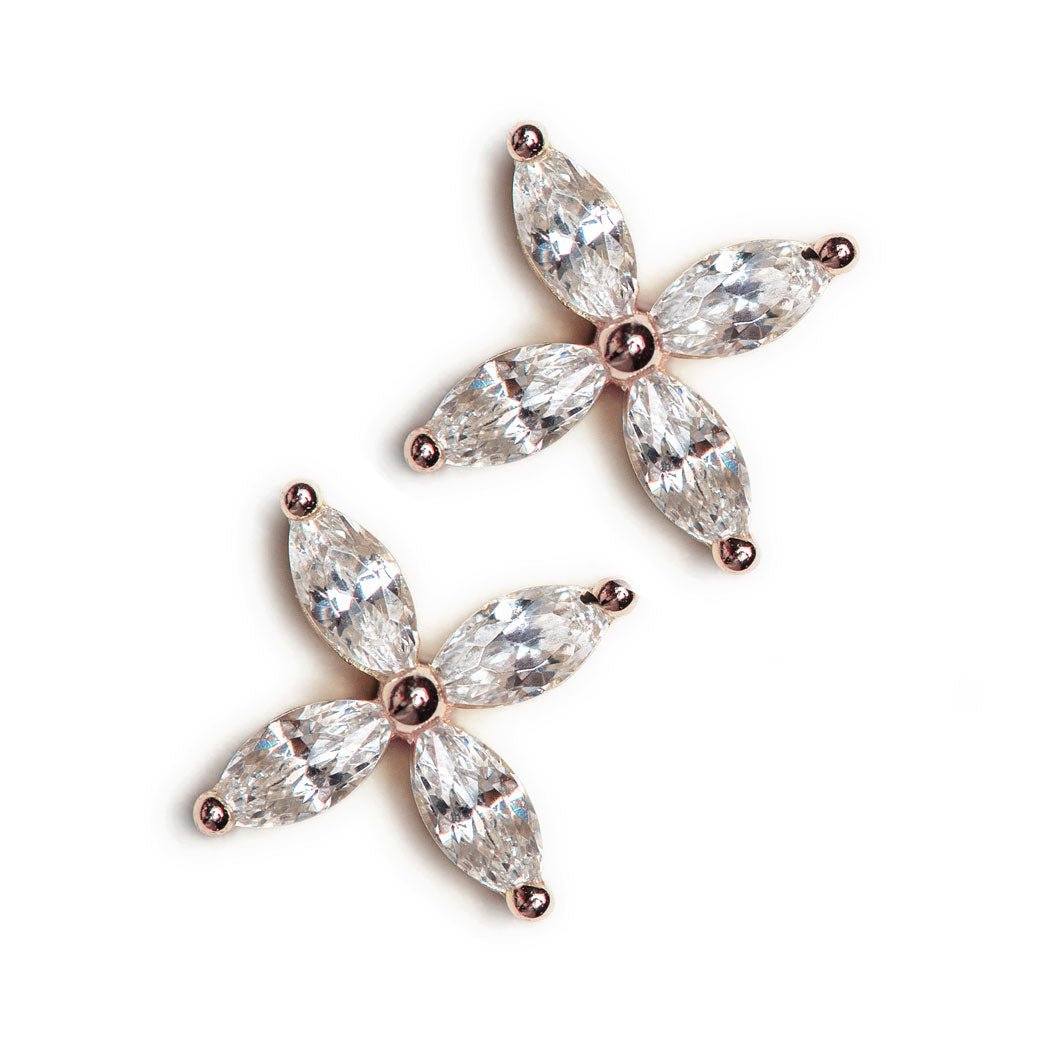 Rose gold vermeil marquise crystal flower studs, close-up detail on a white background