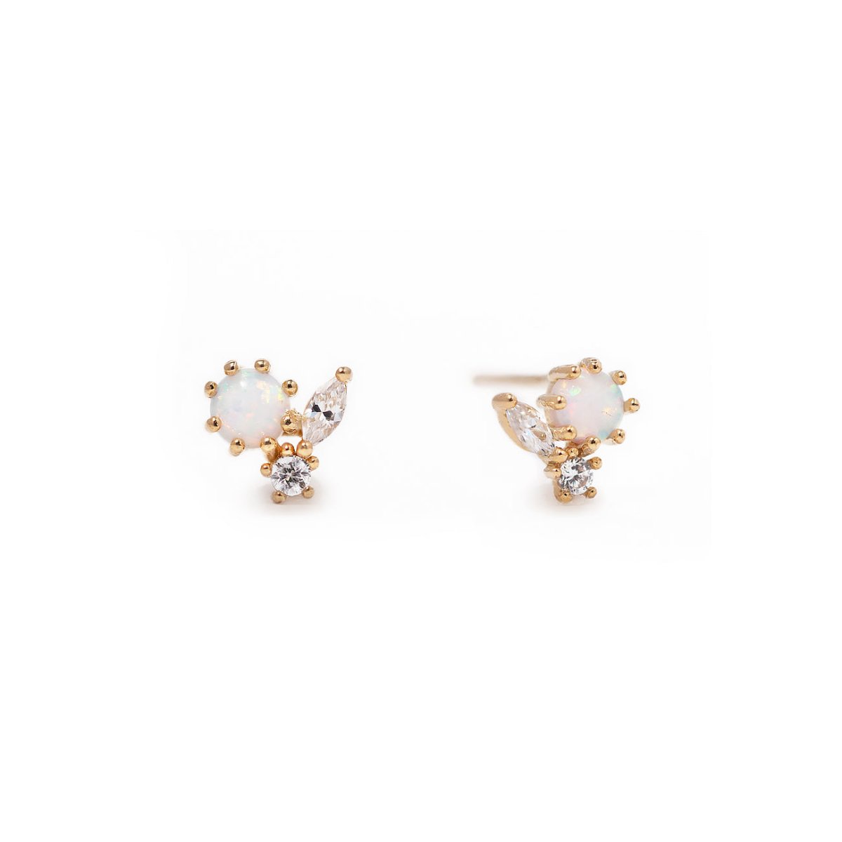 Pair of gold vermeil cluster studs with white opal and clear stones, on a white background