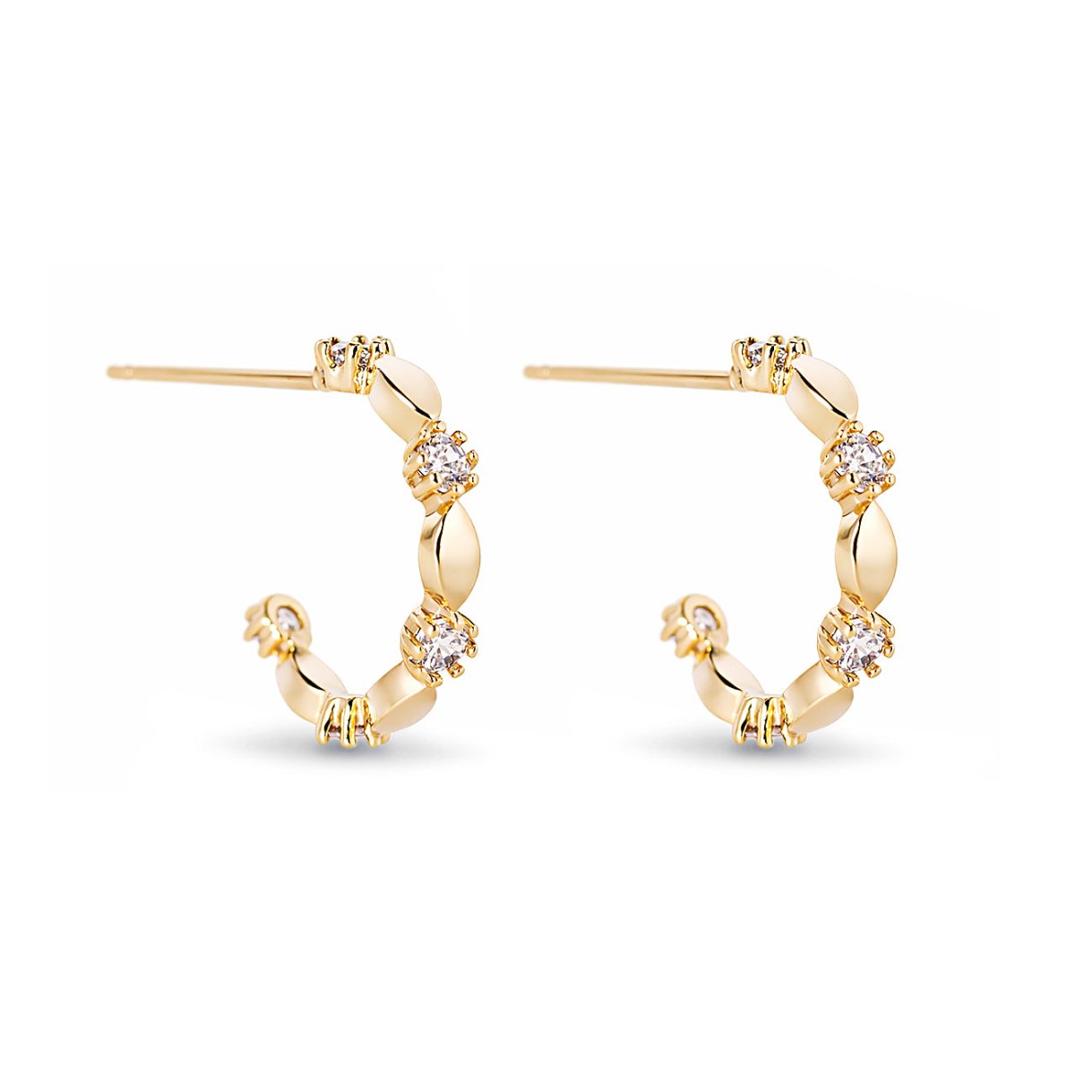 Gold vermeil ornate C hoops with prong-set white zirconia stones, on a white background