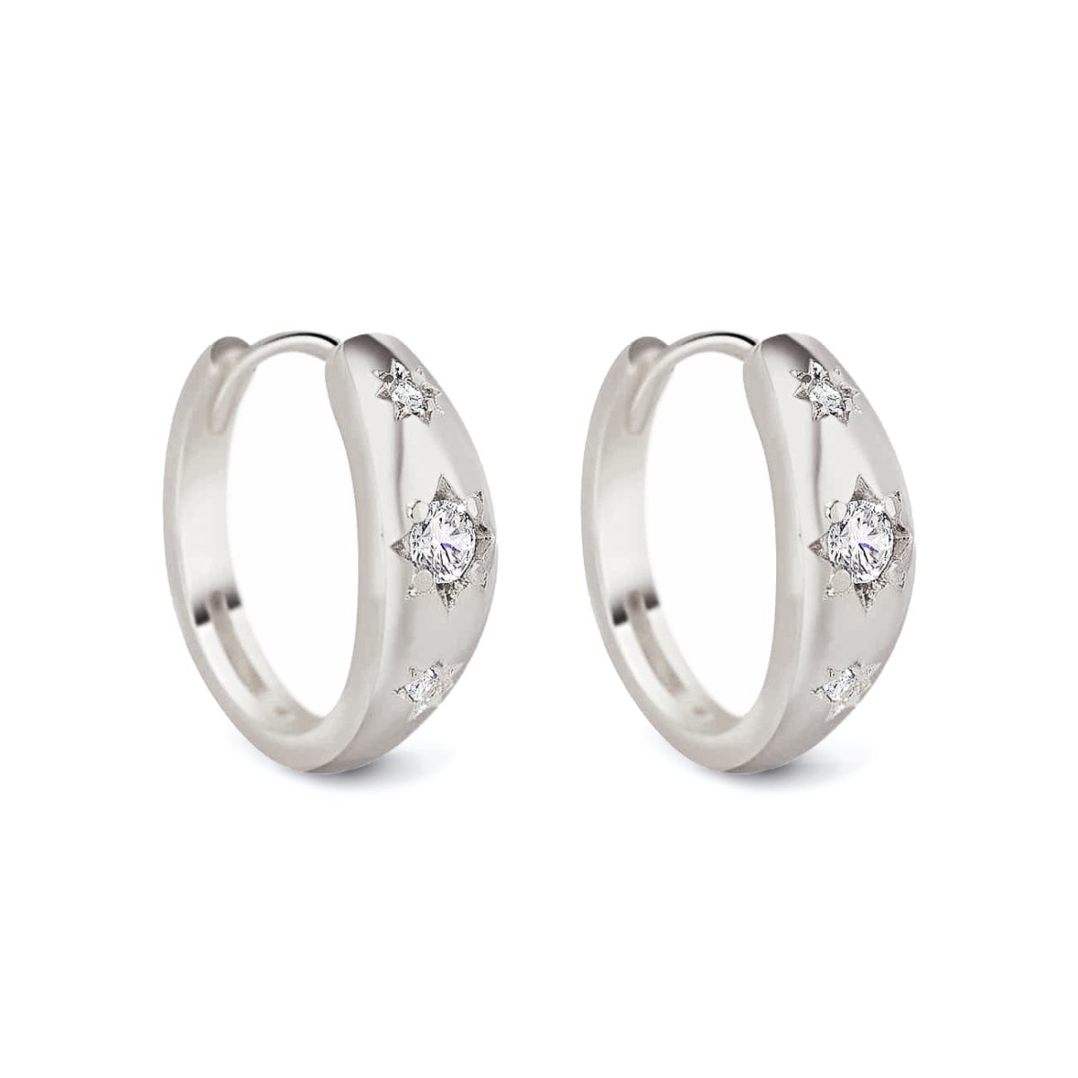 Sterling silver dome huggie hoops with white zirconia star settings, on a white background
