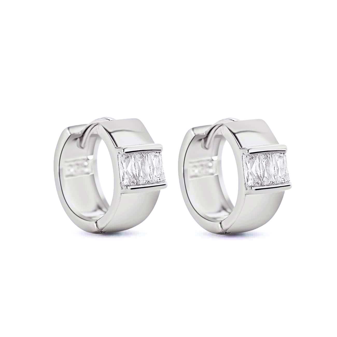 Sterling silver wide huggie hoops with channel-set white zirconia baguettes, on a white background