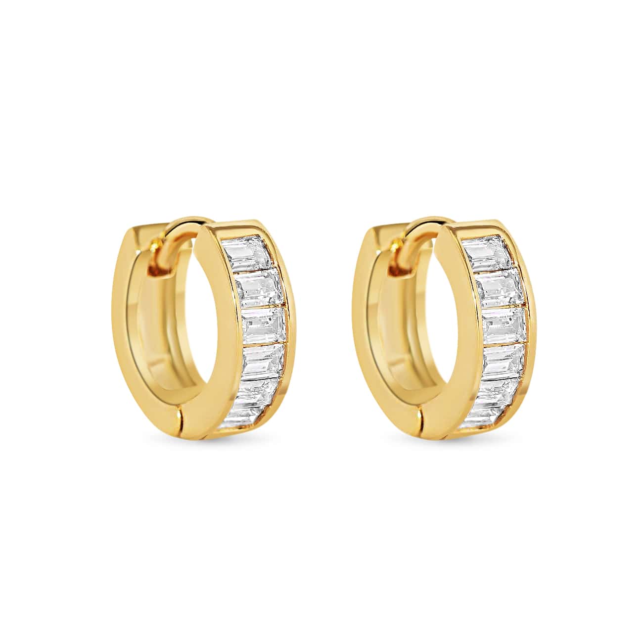 Pair of gold vermeil huggie hoops with channel-set clear baguette stones, on a white background