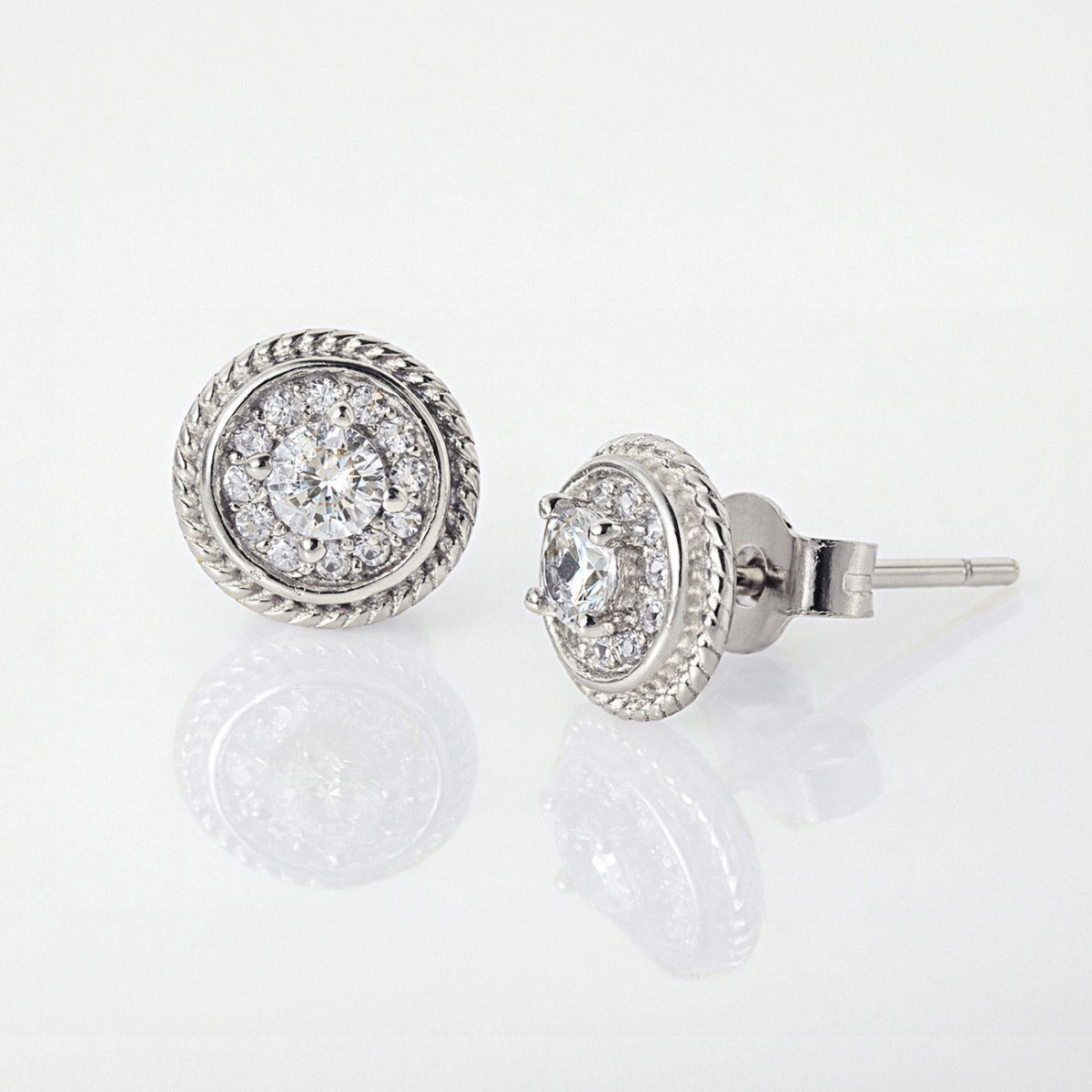 Sterling silver roped halo studs with white zirconia, front and side view on a white background