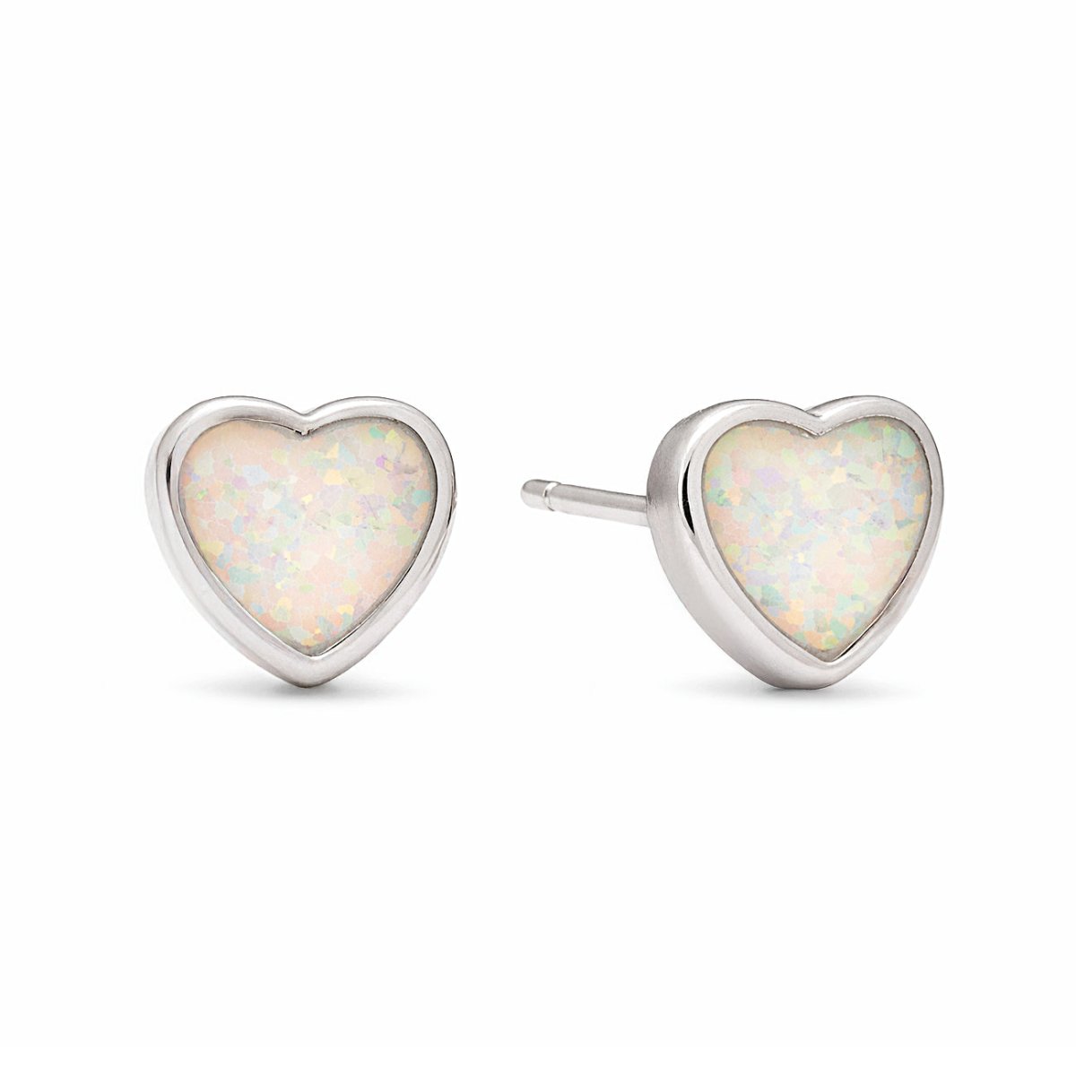 Sterling silver heart bezel studs with white iridescent stones, on a white background