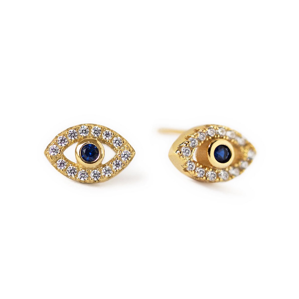 Pair of gold vermeil evil eye studs with blue sapphire centers and clear stones, on a white background