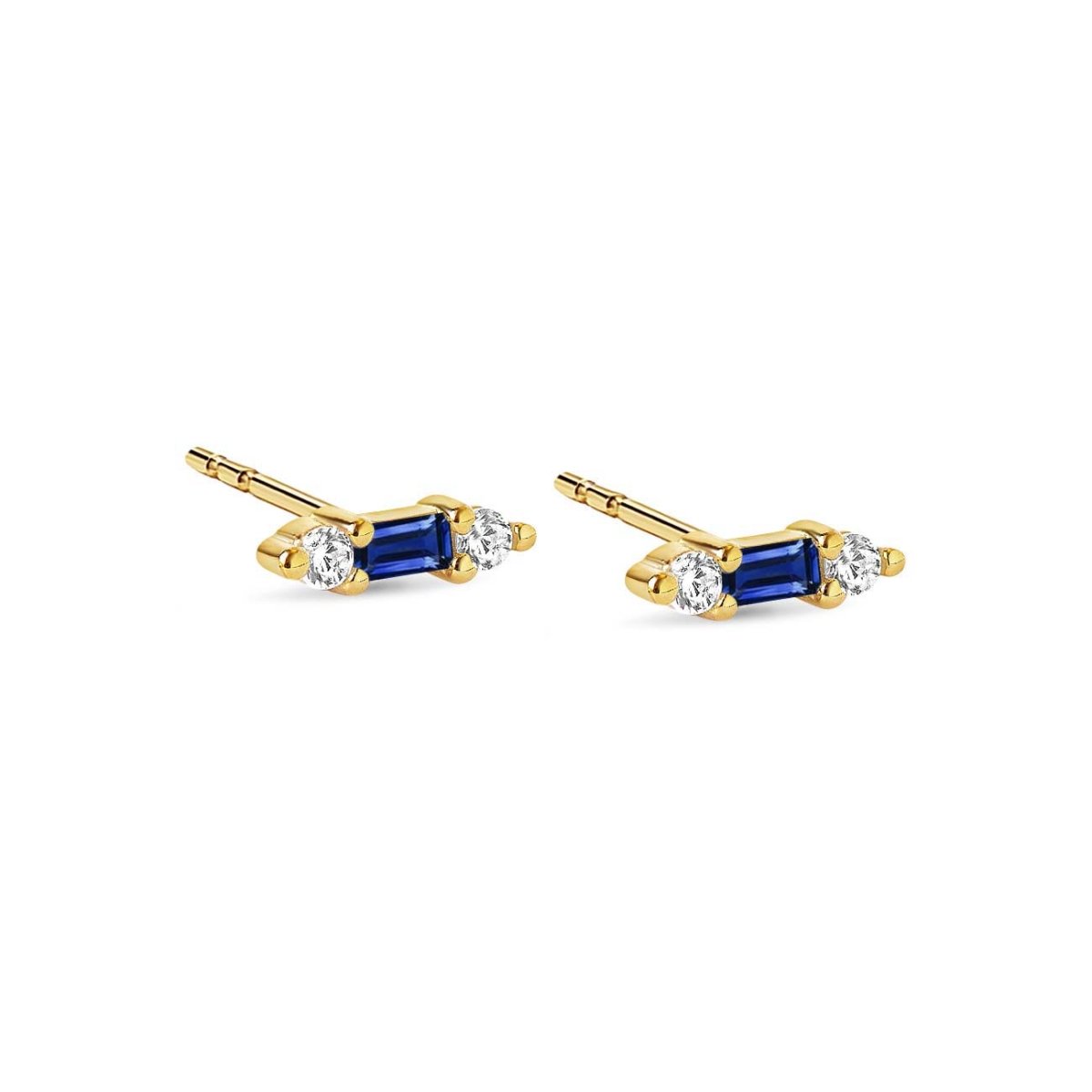 Gold vermeil tiny baguette studs with a blue stone flanked by two clear stones, on a white background