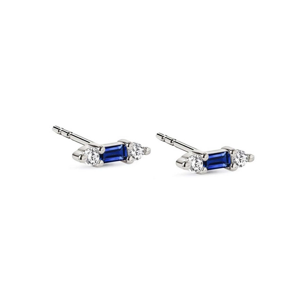Sterling silver tiny baguette studs with a blue stone flanked by two clear stones, on a white background