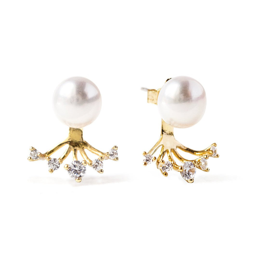 Gold vermeil pearl ear jacket studs with a crystal fan, on a white background