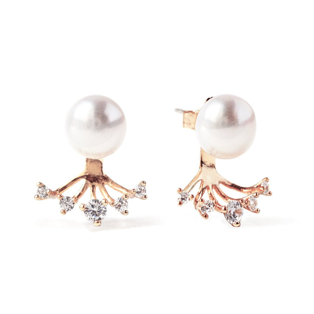 Rose gold vermeil pearl ear jacket studs with a crystal fan, on a white background