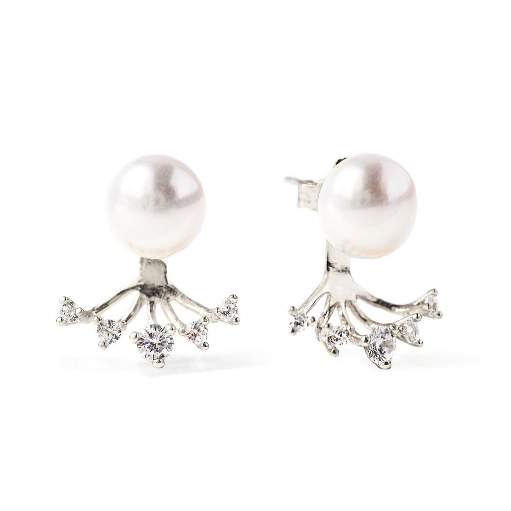 Sterling silver pearl ear jacket studs with a crystal fan, on a white background
