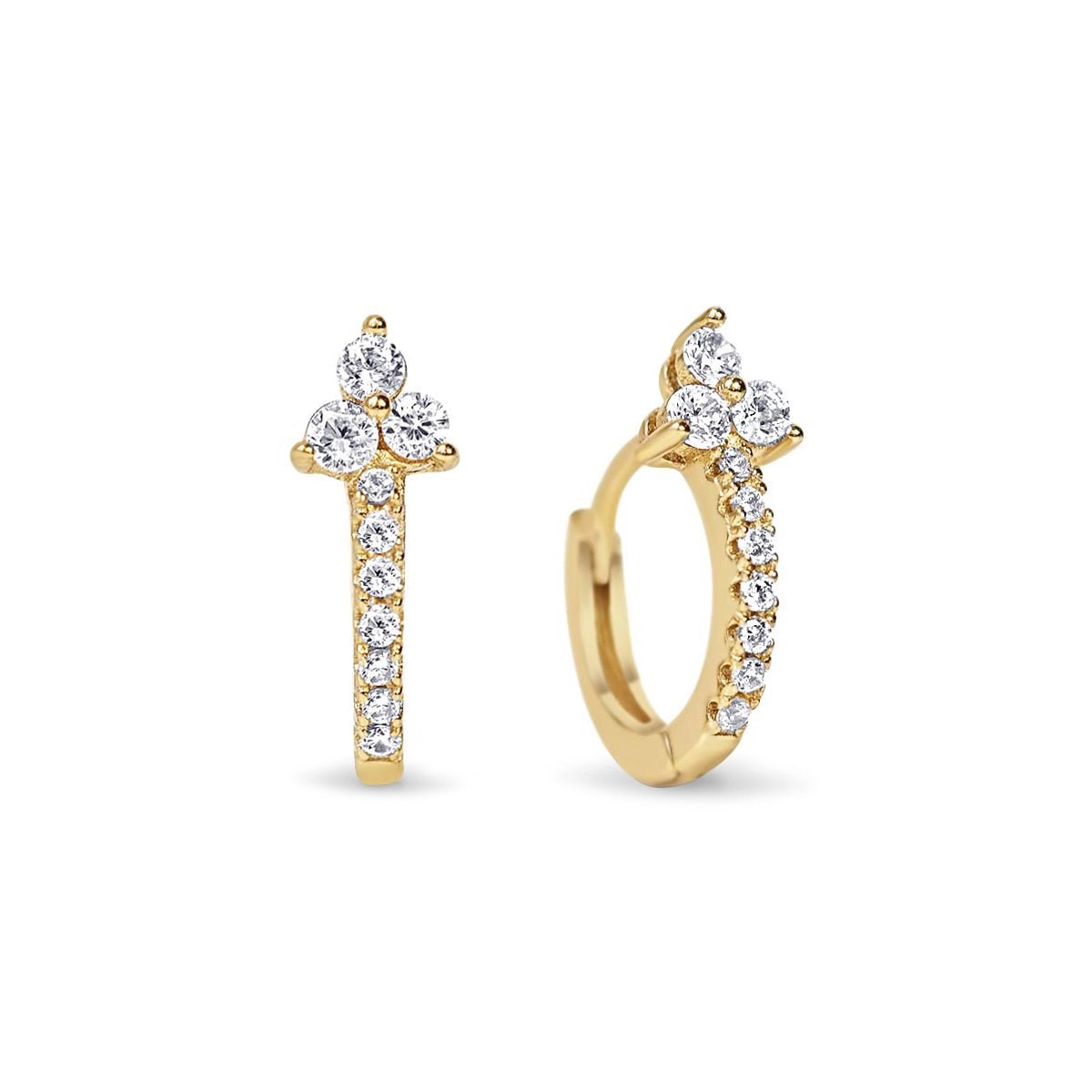 Gold vermeil pavé huggie hoops topped with a trio of white zirconia stones, on a white background