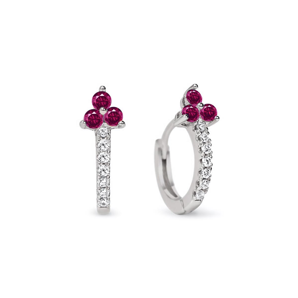 Pair of sterling silver pave huggie hoops with a three-stone ruby cluster, on a white background