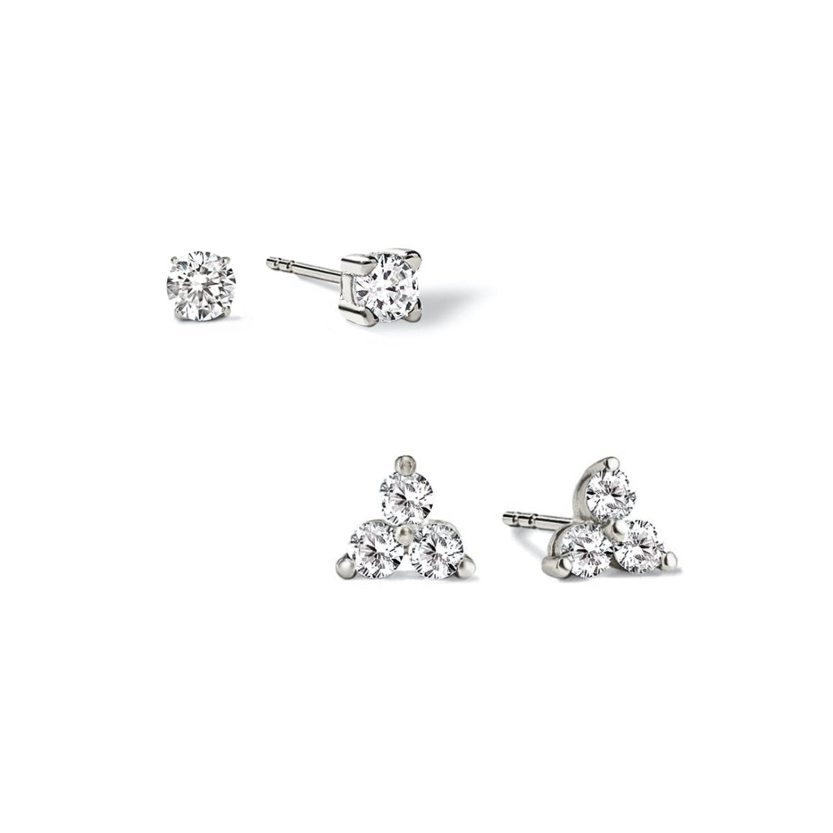 Sterling silver zirconia stud earrings, one solitaire and one three-stone cluster, on a white background