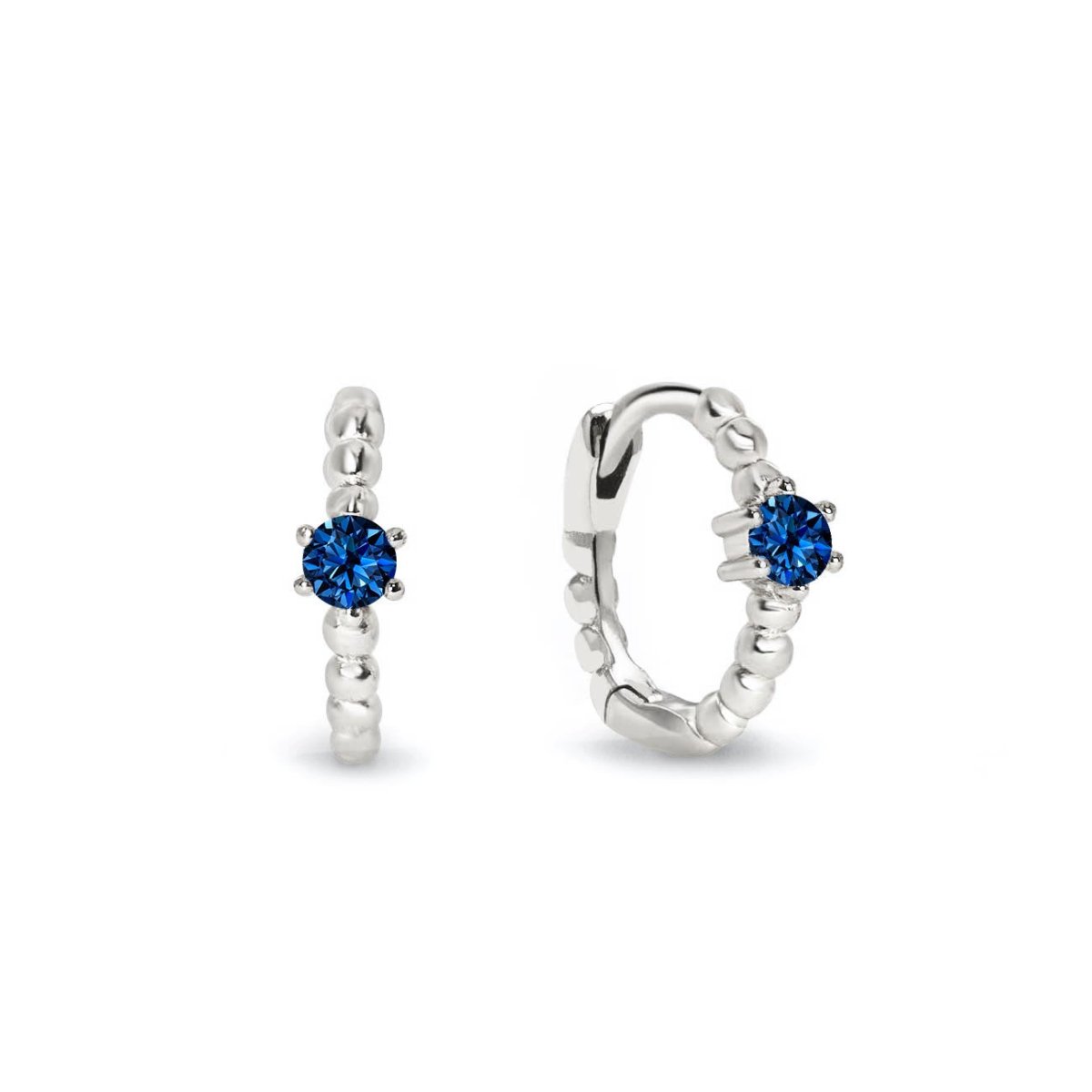 Sterling silver beaded huggie hoops with a round blue sapphire, front and angled views on a white background