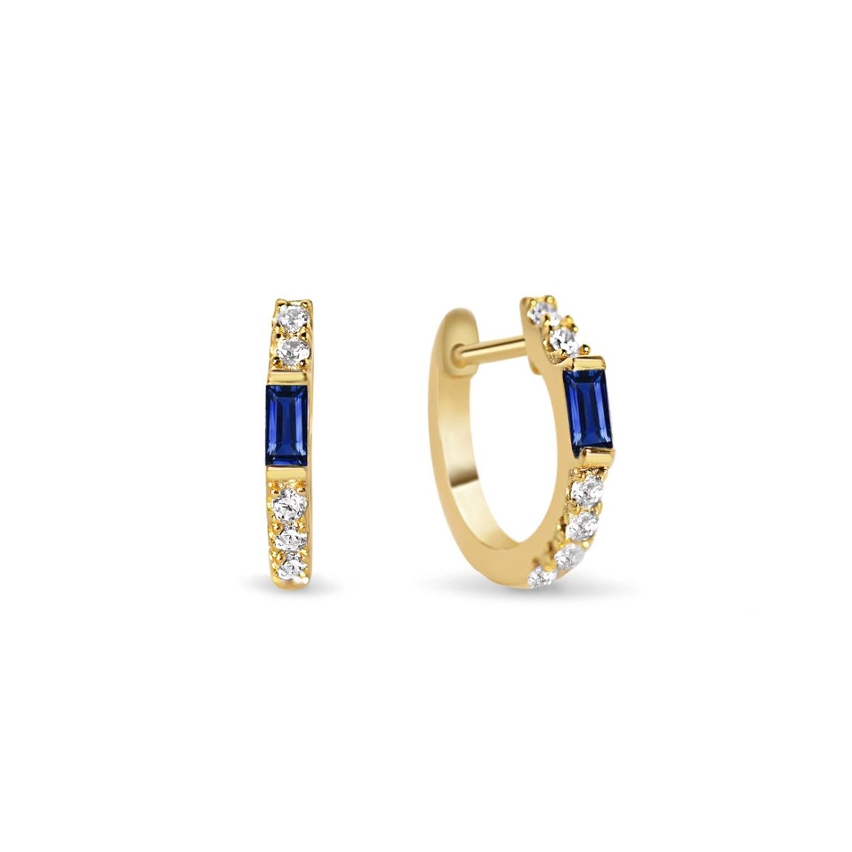 Gold vermeil baguette huggie hoops with a blue sapphire baguette and white zirconia, on a white background
