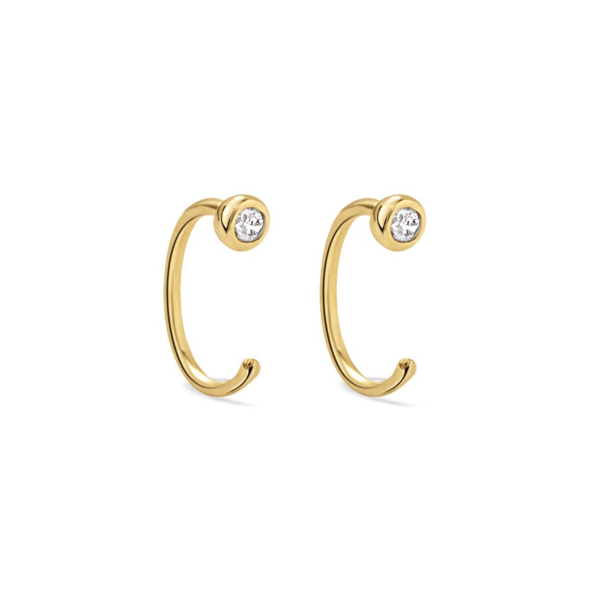 Gold vermeil open huggie earrings with bezel-set white zirconia, on a white background