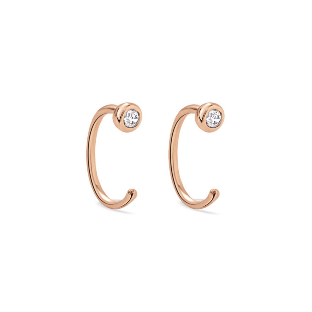 Rose gold vermeil open huggie earrings with bezel-set white zirconia, on a white background