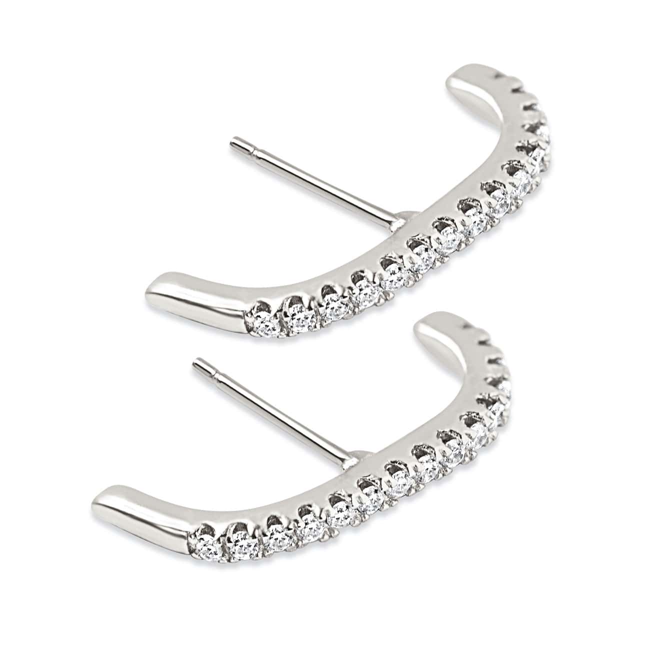 Pair of sterling silver pavé suspender earrings set with white zirconia, on a white background