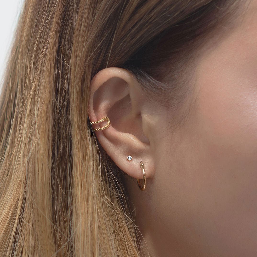 Gold vermeil double rope ear cuff shown on a model's upper ear