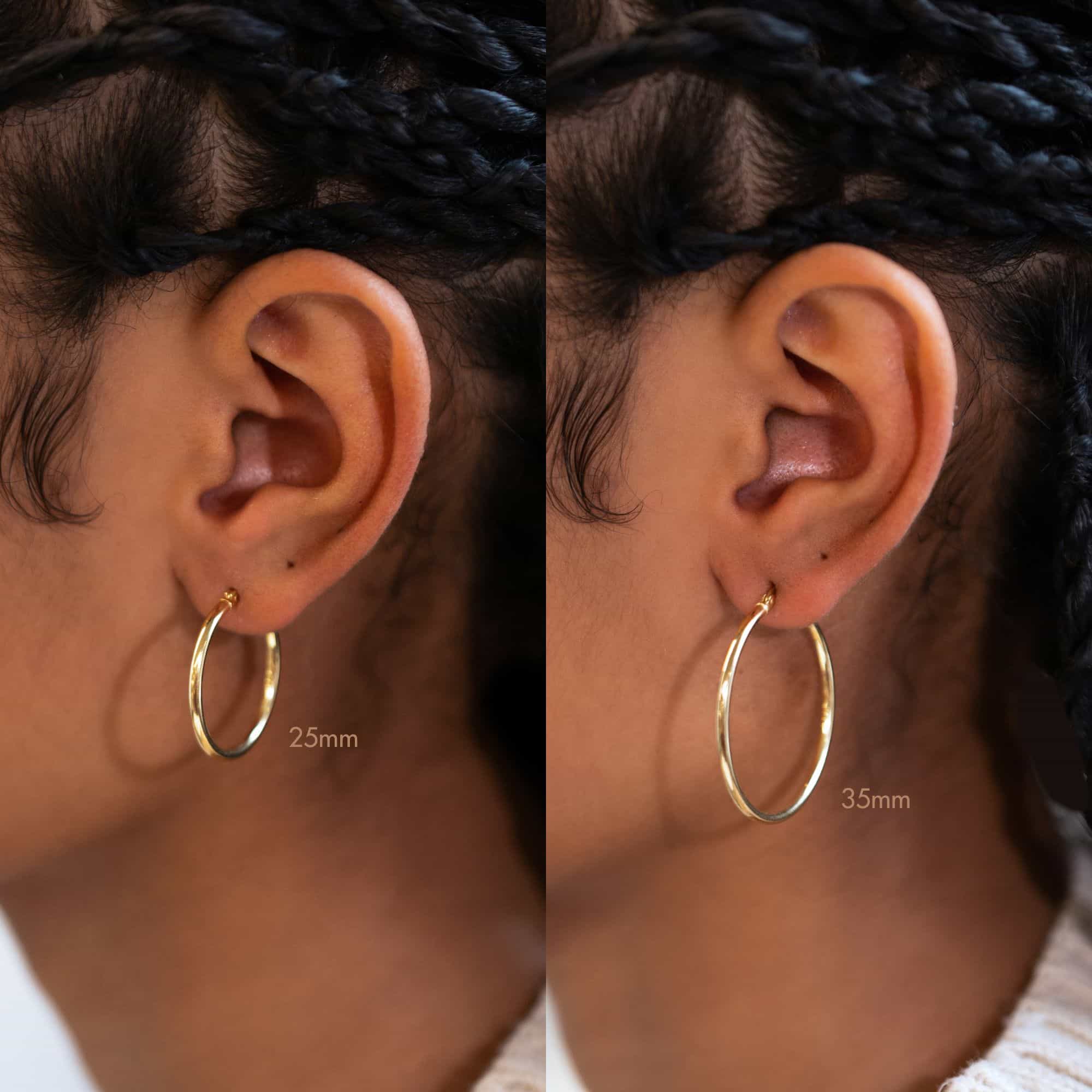 Gold vermeil thin hoop size comparison shown on a model's ear, 25mm and 35mm