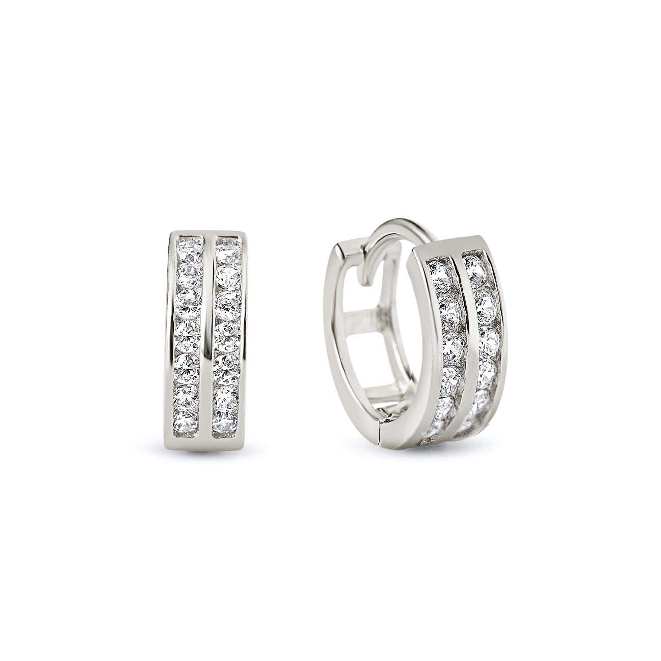 Sterling silver double row pavé huggie hoops with two rows of clear stones, on a white background