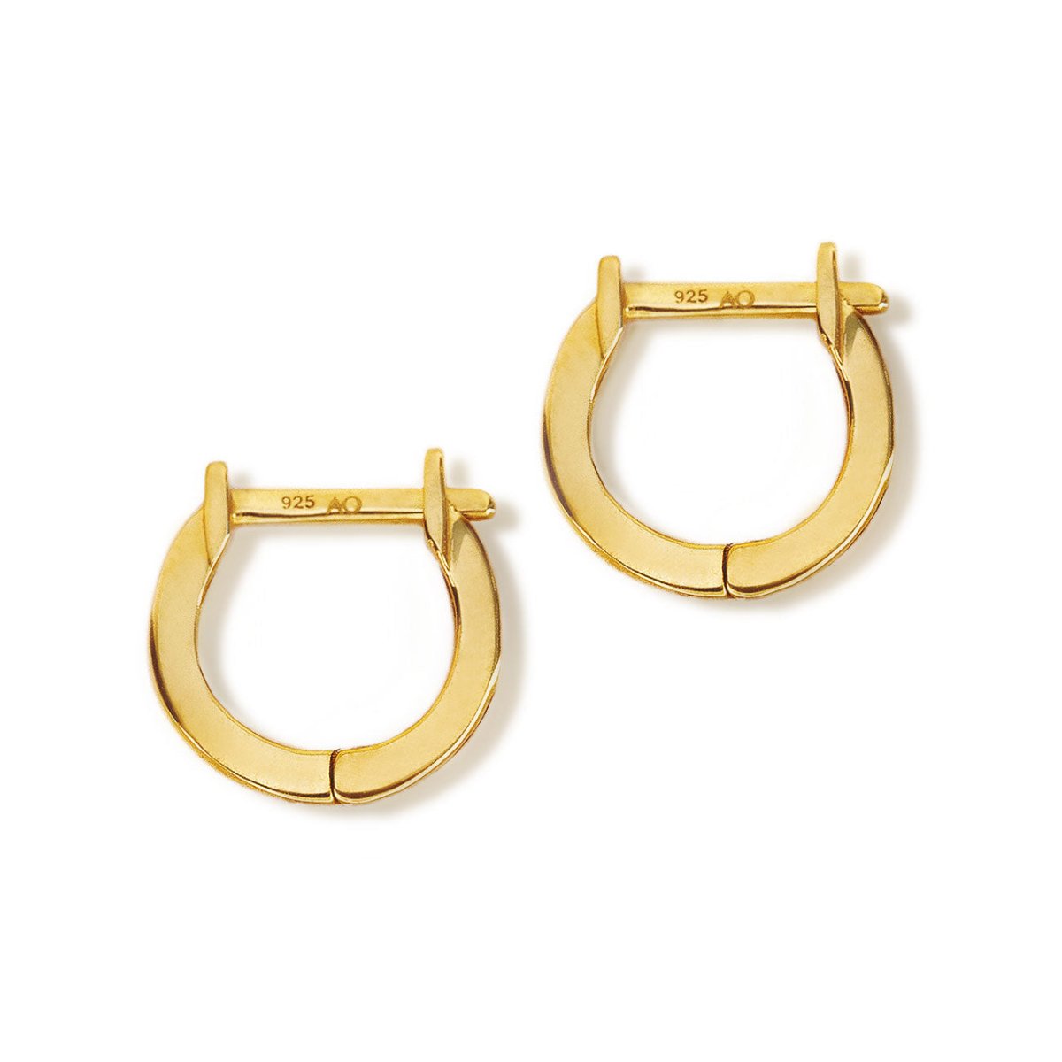 Pair of gold vermeil plain huggie earrings with hinged closures, on a white background